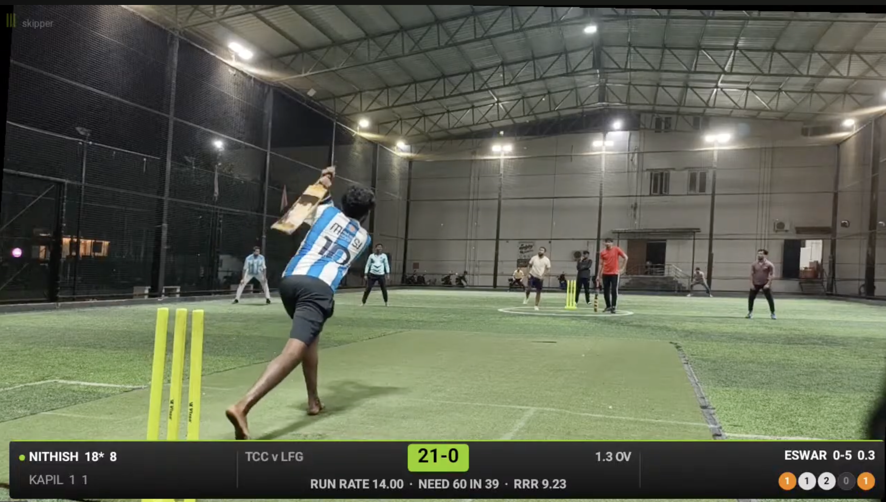 Batsman mid-swing at Turf 39, Tiruppur during a Headlight Cricket-310 match, with the Skipper live scorecard overlay visible